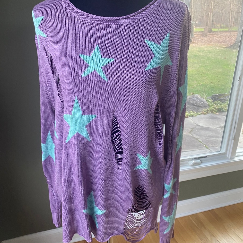 Purple sweater with teal star design